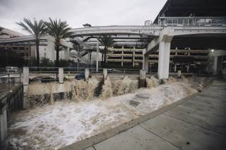 A flash flood rages through the LINQ parking garage and surrounding areas in Las Vegas, Nev. on Monday, Sept. 8, 2014.