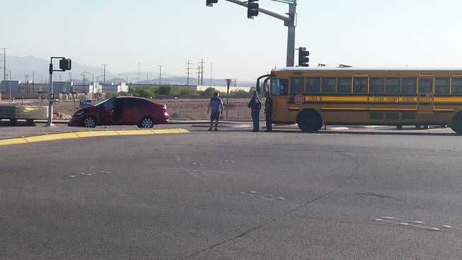 A car ran a red light and hit a school bus that was turning onto Gibson Road after exiting the 215 Beltway on Wednesday, Sept. 9, 2014, according to the Nevada Highway Patrol. No injuries were reported.