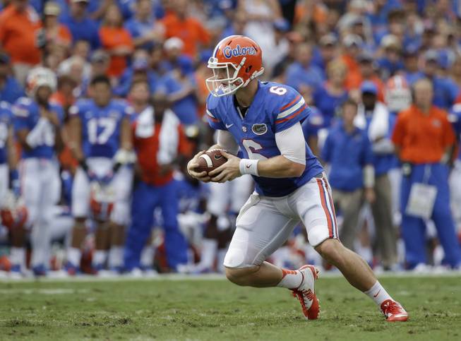 Florida quarterback Jeff Driskel runs against Eastern Michigan during the first half of an NCAA college football game in Gainesville, Fla., Saturday, Sept. 6, 2014.