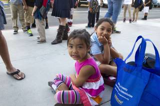 Preschooler Catalina De Soto, 4, waits with her sister Francesca, 6, at Jydstrup Elementary School Monday, Sept. 8, 2014. The diverse student population at Jydstrup spans 37 different first-languages.