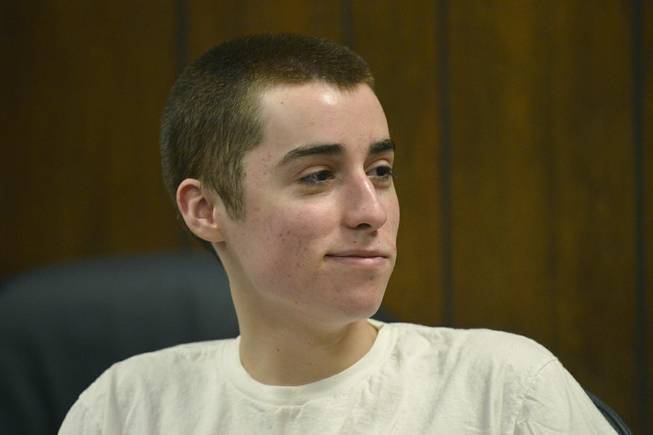 In this March 19, 2013 file photo, T.J. Lane smirks as he listens to the judge during his sentencing in Chardon, Ohio. Ohio police said Thursday, Sept. 11, 2014, that Lane, 19, the convicted killer of three students at a high school cafeteria, escaped from prison and a search is underway. 