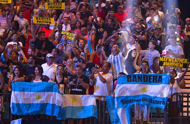 Supporters of Marcos Maidana of Argentina cheer during an official weigh-in at the MGM Grand Garden Arena  Friday, Sept. 12, 2014. Maidana will challenge WBC/WBA welterweight champion Floyd Mayweather Jr. for his titles at the arena on Saturday.