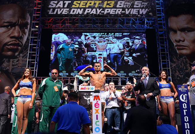 Marcos Maidana of Argentina poses on the scale during an official weigh-in at the MGM Grand Garden Arena  Friday, Sept. 12, 2014. Maidana will challenge WBC/WBA welterweight champion Floyd Mayweather Jr. for his titles at the arena on Saturday. Special to the Sun/Richard Brian