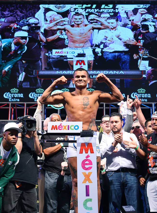 Marcos Maidana of Argentina poses on the scale during an official weigh-in at the MGM Grand Garden Arena  Friday, Sept. 12, 2014. Maidana will challenge WBC/WBA welterweight champion Floyd Mayweather Jr. for his titles at the arena on Saturday. Special to the Sun/Richard Brian