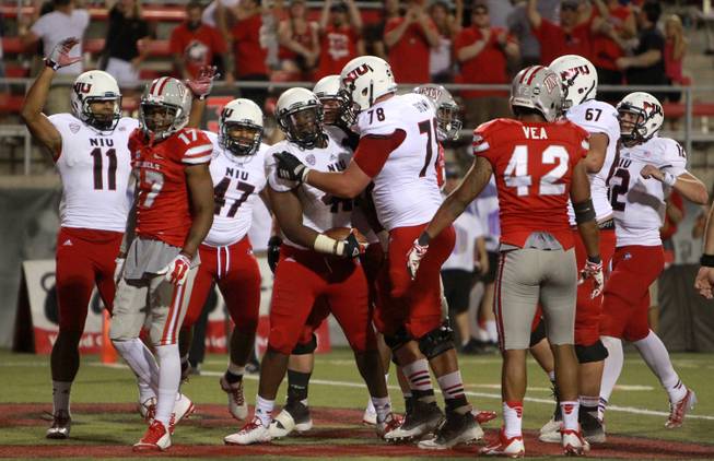Northern Illinois Huskies tailback Cameron Stingily (42) scores the game winning touchdown bringing the score to 47 Huskies, 34 Rebels, during the fourth quarter the UNLV Rebels at Sam Boyd Stadium Saturday, Sept. 13, 2014.