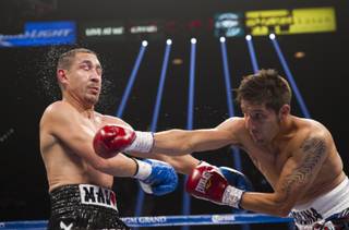 Boxer John Molina Jr. of the U.S. connects on Humberto Soto of Mexico during a junior welterweight bout at the MGM Grand Garden Arena on Saturday, Sept. 13, 2014.