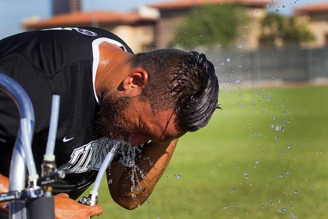 UNLV soccer player Jason Khamvongsa takes a water break during practice at UNLV Thursday, Sept. 18, 2014.