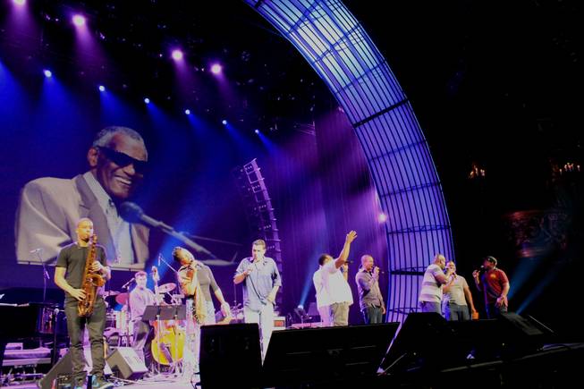 The image of Ray Charles looms over Nnenna Freelon, Clint Holmes and members of Take 6 during rehearsals of "Georgia on My Mind" at Venetian Theater on Tuesday, Sept. 16, 2014, in Las Vegas.