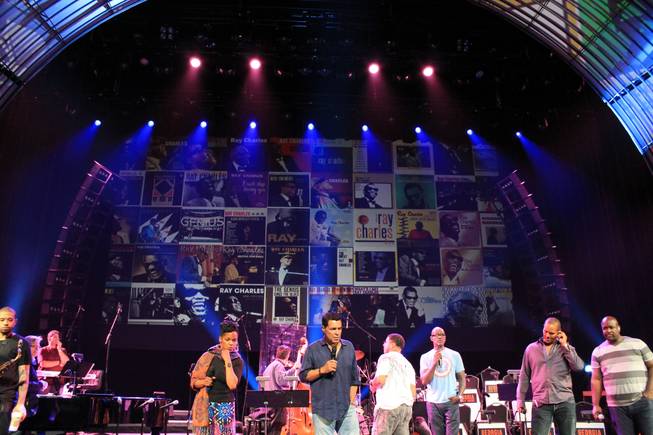 Nnenna Freelon, Clint Holmes and members of Take 6 are shown in front of the LED screen of Ray Charles album covers during rehearsals of "Georgia on My Mind" at Venetian Theater on Tuesday, Sept. 16, 2014, in Las Vegas.