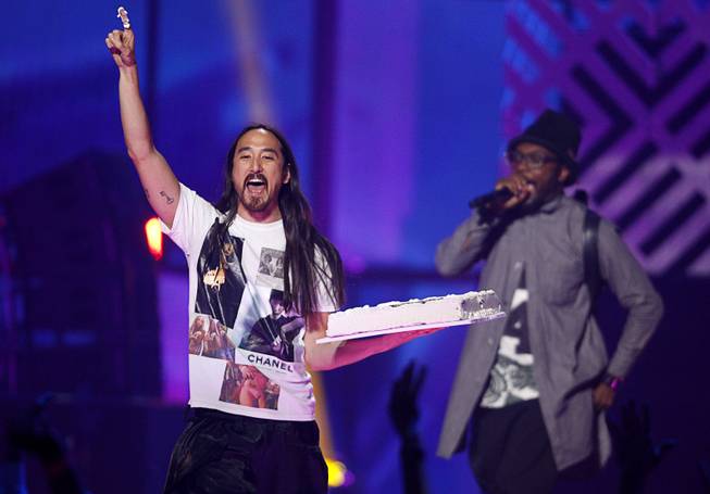 DJ Steve Aoki and Will.I.Am perform during the 2014 iHeartRadio Music Festival at MGM Grand Garden Arena on Friday, Sept. 19, 2014, in Las Vegas.