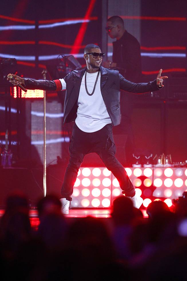 Usher performs during the 2014 iHeartRadio Music Festival at MGM Grand Garden Arena on Friday, Sept. 19, 2014, in Las Vegas.