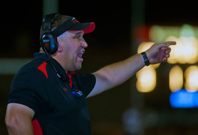 Las Vegas head coach ames Thurman yells instructions to his players on Friday, September 19, 2014.