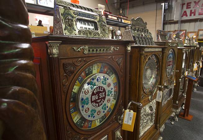A Mills Big Six slot machine from 1906 is displayed during an auction at Victorian Casino Antiques, 4520 Arville St., Sunday Sept. 21, 2014. The William F. Harrah Antique Gambling Machine collection was the centerpiece of a three-day live auction event. The collection included more than 90 upright slot machines, trade stimulators, three-reelers and floor consoles hailing from the late 1800s to the mid-1900s.