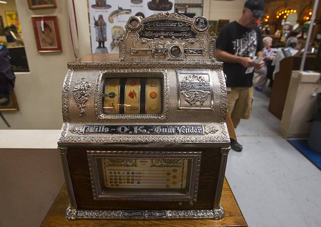 A Mills Front OK Vendor slot machine is displayed during an auction at Victorian Casino Antiques, 4520 Arville St., Sunday Sept. 21, 2014. The slot sold for $81.50 in 1925. The William F. Harrah Antique Gambling Machine collection was the centerpiece of a three-day live auction event. The collection included more than 90 upright slot machines, trade stimulators, three-reelers and floor consoles hailing from the late 1800s to the mid-1900s.