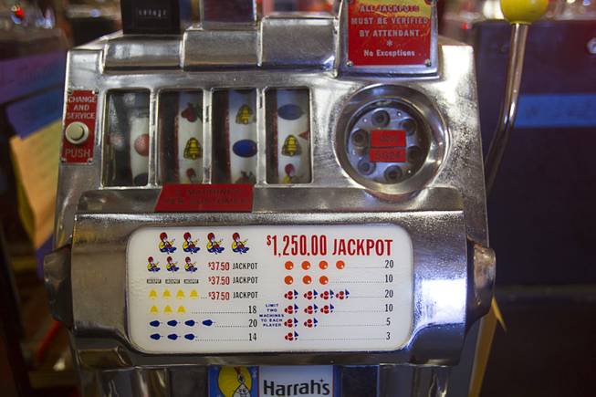 A 1945 quarter slot machine from Harrah's is displayed during an auction at Victorian Casino Antiques, 4520 Arville St., Sunday Sept. 21, 2014. The William F. Harrah Antique Gambling Machine collection was the centerpiece of a three-day live auction event. The collection included more than 90 upright slot machines, trade stimulators, three-reelers and floor consoles hailing from the late 1800s to the mid-1900s.