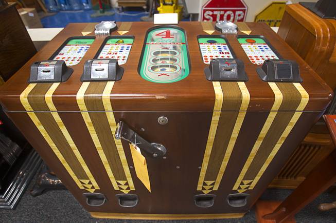 A 1937 Jennings Aristocrat Console, a club and fraternity game, is displayed during an auction at Victorian Casino Antiques, 4520 Arville St., Sunday Sept. 21, 2014. The William F. Harrah Antique Gambling Machine collection was the centerpiece of a three-day live auction event. The collection included more than 90 upright slot machines, trade stimulators, three-reelers and floor consoles hailing from the late 1800s to the mid-1900s.
