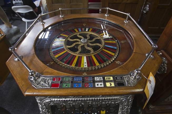 A 1904 25-cent Caille Roulette machine is displayed during an auction at Victorian Casino Antiques, 4520 Arville St., Sunday Sept. 21, 2014. The William F. Harrah Antique Gambling Machine collection was the centerpiece of a three-day live auction event. The collection included more than 90 upright slot machines, trade stimulators, three-reelers and floor consoles hailing from the late 1800s to the mid-1900s.