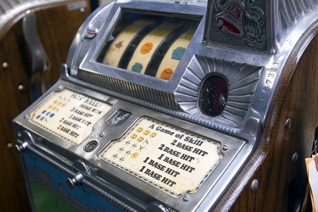 A 5-cent novelty baseball slot machine is displayed during an auction at Victorian Casino Antiques, 4520 Arville St., Sunday Sept. 21, 2014. The William F. Harrah Antique Gambling Machine collection was the centerpiece of a three-day live auction event. The collection included more than 90 upright slot machines, trade stimulators, three-reelers and floor consoles hailing from the late 1800s to the mid-1900s.