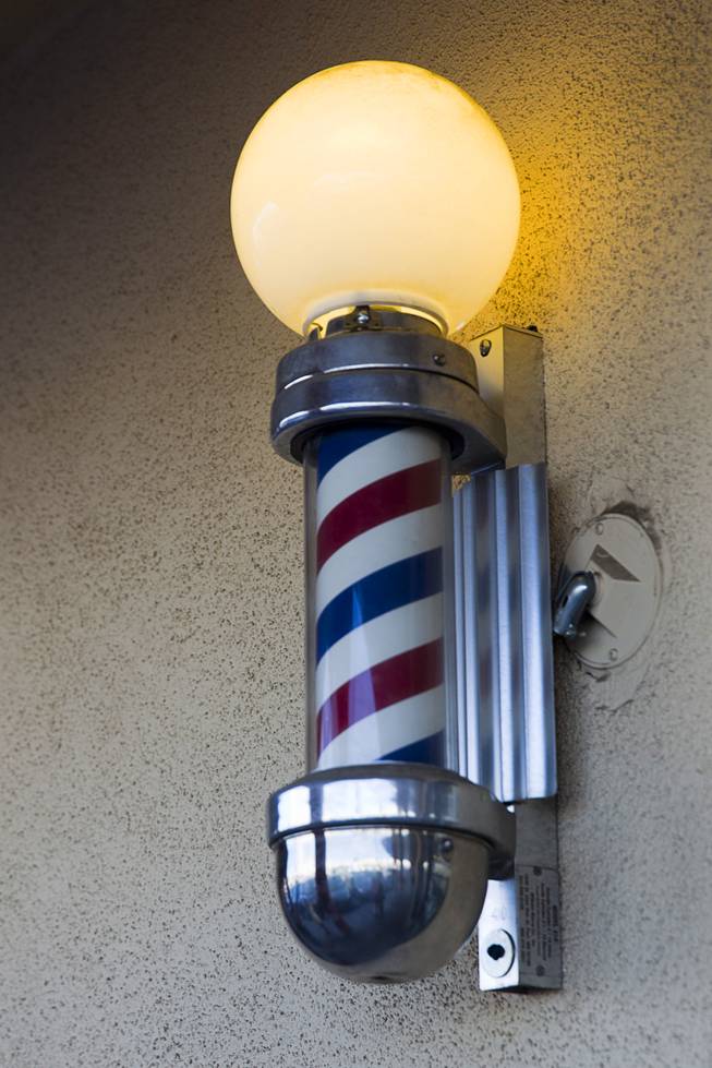 A barber pole is shown outside at Geraldo's Classic Barber Shop, 3869 Spring Mountain Rd., Sunday Sept. 21, 2014.
