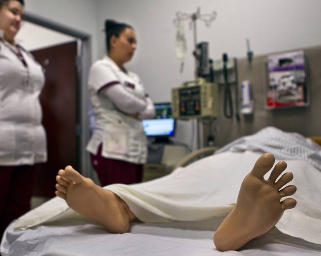 The accelerated bachelor of nursing program at Roseman University in Henderson uses a simulation lab with mannequins that emit lifelike noise and responses as the students work with "patients" on Thursday, September 18, 2014.  L.E. Baskow.