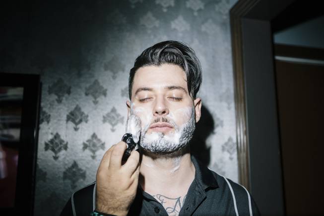 Johnny Snips demonstrates how to prep for a shave at Fino for Men in Las Vegas, Nev. on September 20, 2014.