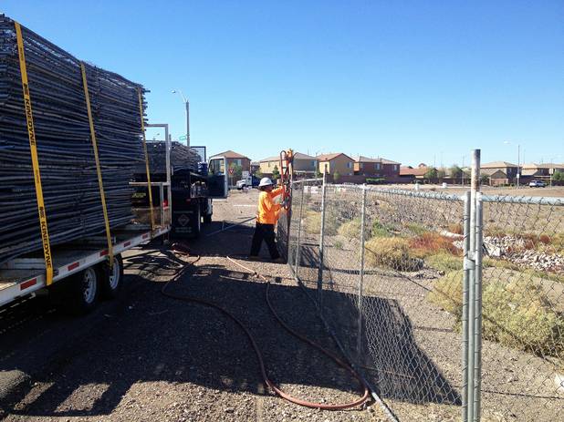 Developers of Union Village, the proposed $1.2 billion hospital-retail-residential project on Galleria Drive at U.S. 95 in Henderson, plan to hold a ceremonial groundbreaking Oct. 8. Above, workers install fencing around the project site on Monday, Sept. 22, 2014.
