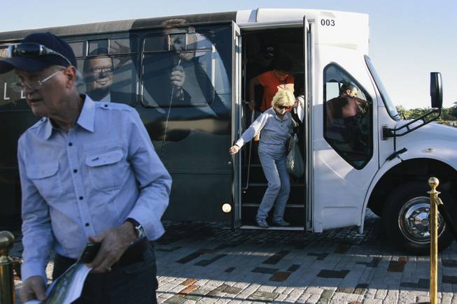 Locals unload from a shuttle bus to see Wayne Newton's former home, once known as Casa de Shenandoah, during an open house on Monday, September 22, 2014.