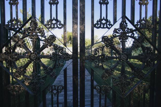 Gates leading to a zoo area outside of Wayne Newton's former home, once known as Casa de Shenandoah, during an open house on Monday, September 22, 2014.