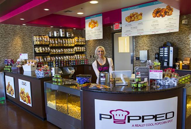 Brianna Scioscia mans the counter at Popped, a gourmet popcorn shop at 3700 S. Hualapai Way, Wednesday Sept. 24, 2014. The shop blasts popcorn with liquid nitrogen (-321F) to create a frozen popcorn dessert.