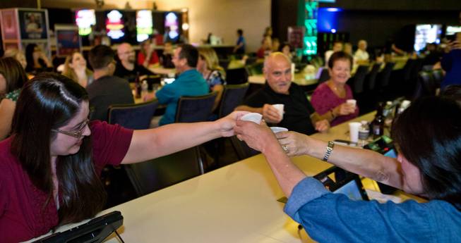 Players toast a win from their seats at Green Valley Ranch  during electronic bingo complete with live DJ music and cash awards on Tuesday, September 23, 2014. .