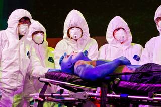 Death stalks over the sickened Earth as nurses perform a colorful skit in the morning at Planet Hollywood. More than 1,000 nurses came together to highlight the threat to public safety from Ebola and other pandemics in the U.S. and other nations on Wednesday, September 24, 2014. 