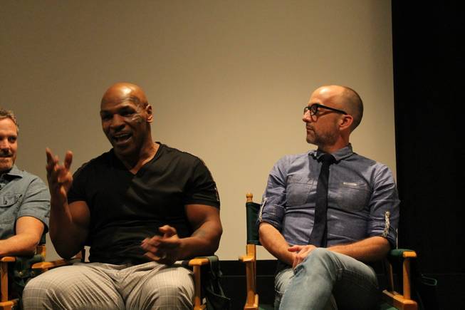 Mike Tyson is shown with actor Jim Rash during the news conference and screening of the upcoming Adult Swim series, "Mike Tyson Mysteries," at Warner Bros. Studios in Burbank, Calif., on Tuesday, Sept. 23, 2014.