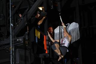 An aerialist is lowered from a catwalk during a rehearsal in the Life nightclub at the SLS Las Vegas Thursday Sept. 25, 2014.