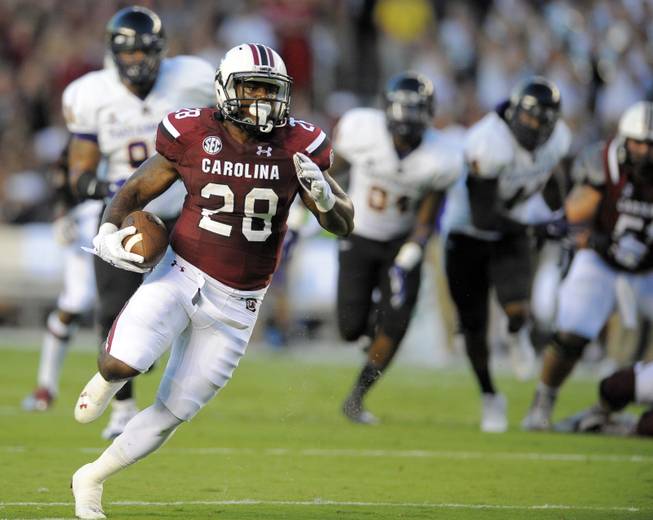South Carolina running back Mike Davis (28) runs for a touchdown during first half of an NCAA college football game against the East Carolina, Saturday, Sept. 6, 2014, in Columbia, S.C. (AP Photo/Stephen B. Morton)