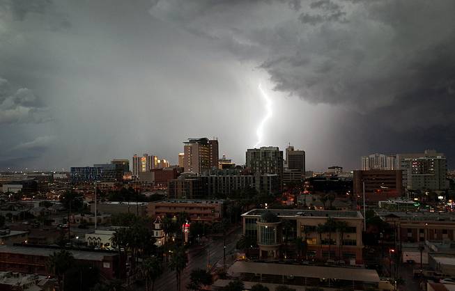Lightning strikes near downtown Las Vegas around 7 p.m. Friday, Sept. 26, 2014.