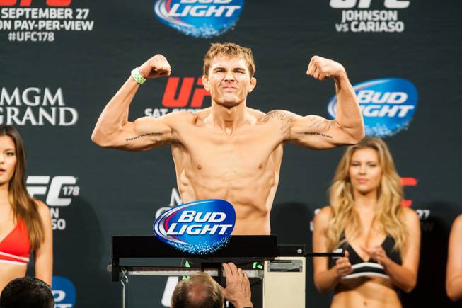 Cody Gibson flexes on the scale after making weight for ...