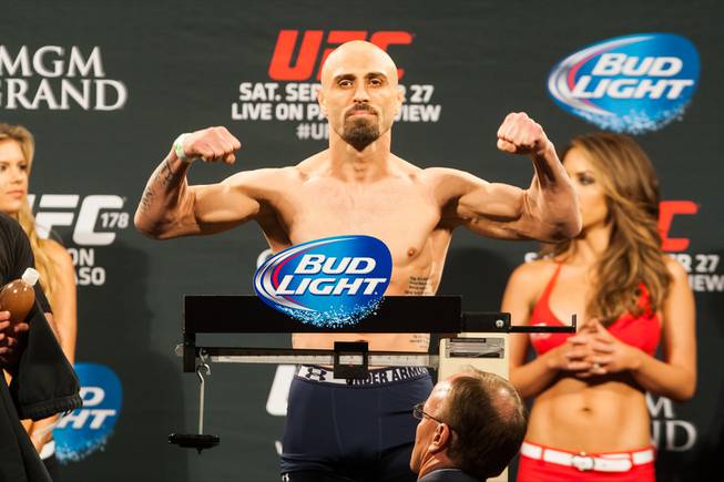 Manvel Gamburyan flexes on the scale after making weight for ...
