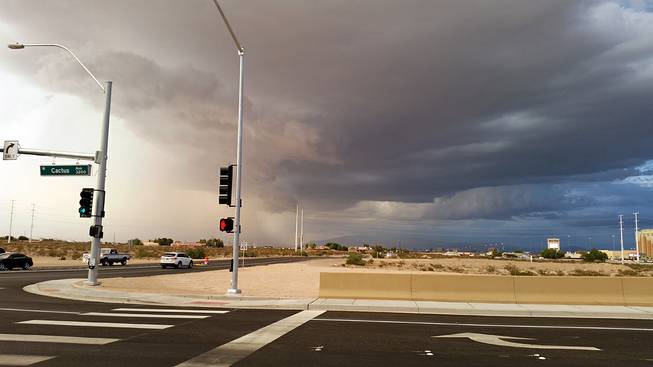 Dark clouds are seen looking north from Cactus Avenue and Interstate 15, Friday, Sept. 26, 2014.