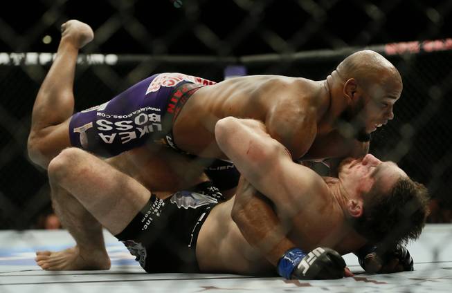 Middleweight fighter Yoel Romero slams opponent Tim Kennedy to the canvas on his way to a knockout win at UFC 178 on Saturday, Sept. 27, 2014.