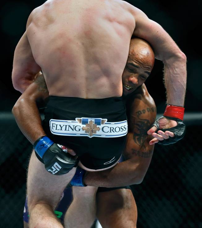 Middleweight fighter Yoel Romero wraps up while lifting Tim Kennedy during UFC 178 at the MGM Grand Garden Arena on Saturday, September 27, 2014.