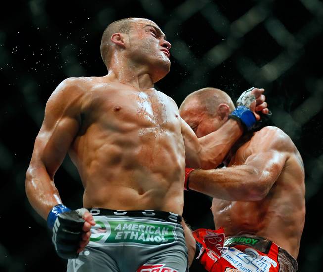 Lightweight fighter Eddie Alvarez connects with a spinning backhand on opponent Donald Cerrone during UFC 178 at the MGM Grand Garden Arena on Saturday, September 27, 2014. .