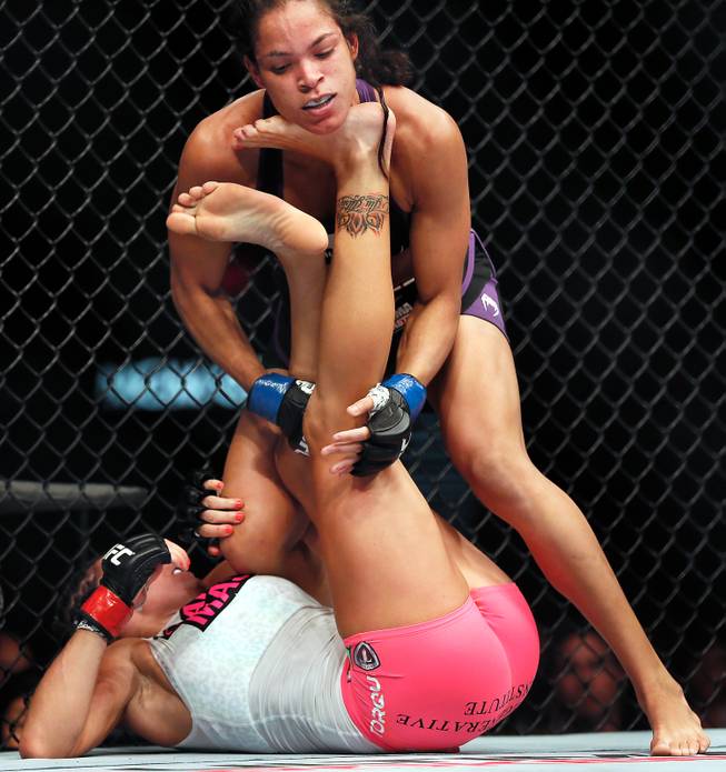 Women's Bantamweight fighter Cat Zingano drives her foot under the chin of opponent Amanda Nunes during UFC 178 at the MGM Grand Garden Arena on Saturday, September 27, 2014.