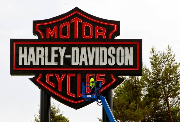 Workers with the Ad Art Sign Company mount a sign outside the new Las Vegas Harley-Davidson motorcycle dealership on the South Strip on Thursday, July 10, 2014. The store is scheduled to open later this week.