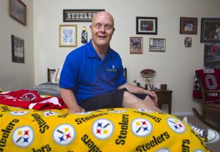 David Abraham Jr., 50, poses at his home Monday Sept. 29, 2014. Abraham, who has Down Syndrome, is being recognized by the Down Syndrome Organization of Southern Nevada as volunteer of the year.