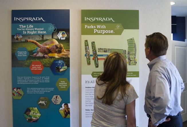 A couple looks over a display on parks in a KB Home sales office at the Inspirada master-planned community in Henderson Monday Sept. 29, 2014. STEVE MARCUS