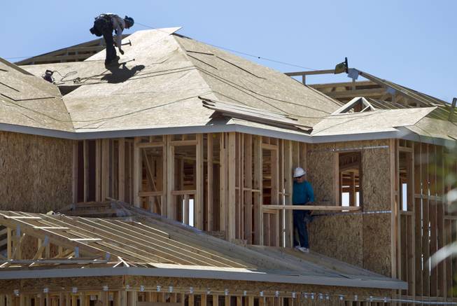 Carpenters work on a new home at Inspirada master-planned community in Henderson Monday Sept. 29, 2014. STEVE MARCUS