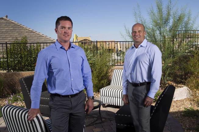Rob McGibney, left, division president of KB Home Las Vegas, and Klif Andrews, Southern Nevada division president of Pardee Homes, are shown in the backyard of a model home at the Inspirada master-planned community in Henderson Monday, Sept. 29, 2014. 