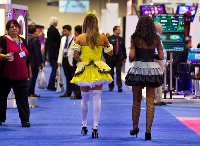 Several of the many costumed characters meet with attention during the Global Gaming Expo (G2E) taking place at the Sands Expo onTuesday, September 30, 2014. .