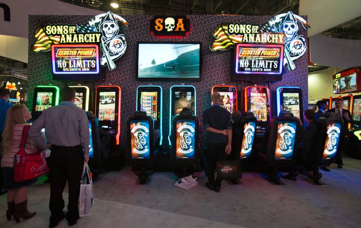 Attendees enjoy the new Sons of Anarchy show slot machines by Aristocrat during the Global Gaming Expo (G2E) at the Sands Expo onTuesday, September 30, 2014. .