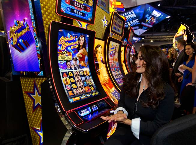 Lynda Carter plays on her new Wonder Woman slot machines unveiled during the Global Gaming  Expo (G2E) at the Sands Expo onTuesday, September 30, 2014.